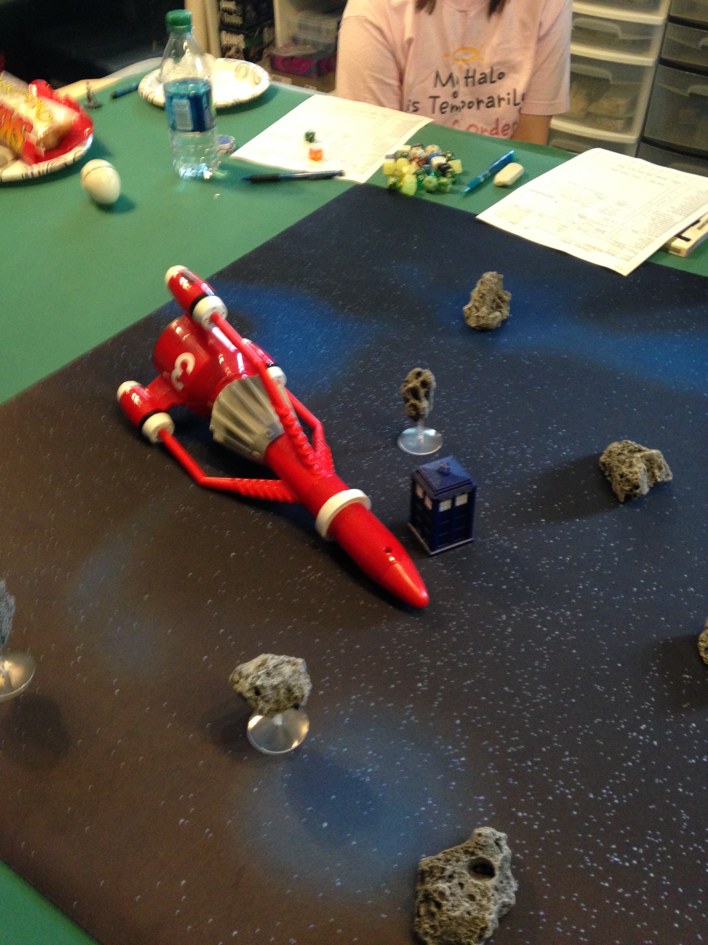 The TARDIS and the mysterious ship from Owen's Doctor Who game. 